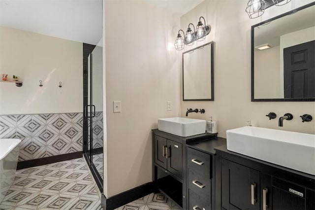 full bath with a stall shower, double vanity, and a freestanding tub