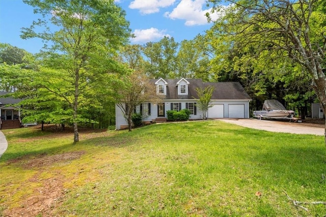 cape cod-style house with a garage, concrete driveway, and a front yard