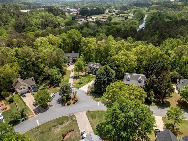 aerial view of property's location with a forest