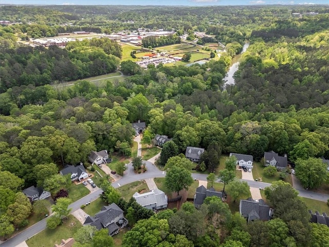aerial view of residential area with a forest