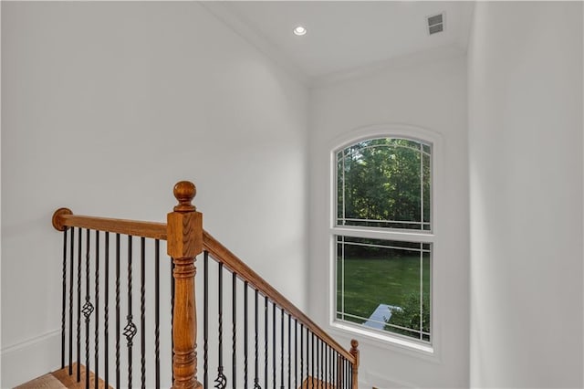 stairway featuring crown molding, visible vents, and recessed lighting