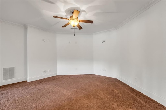 unfurnished room featuring a ceiling fan, carpet, visible vents, and crown molding