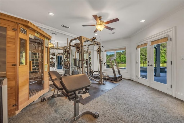 workout area with ornamental molding, dark carpet, and visible vents