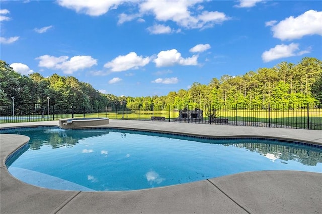 view of pool with a fenced in pool and fence