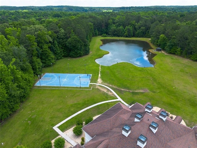 aerial view featuring a water view and a wooded view