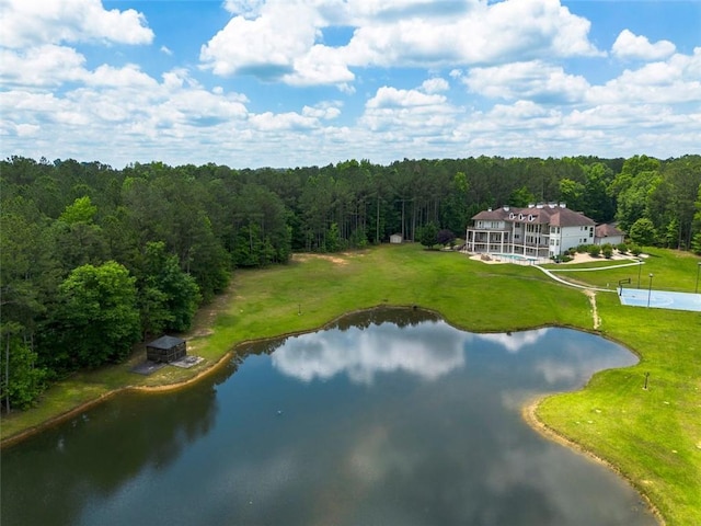 aerial view featuring a water view and a wooded view