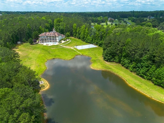 birds eye view of property featuring a water view and a forest view