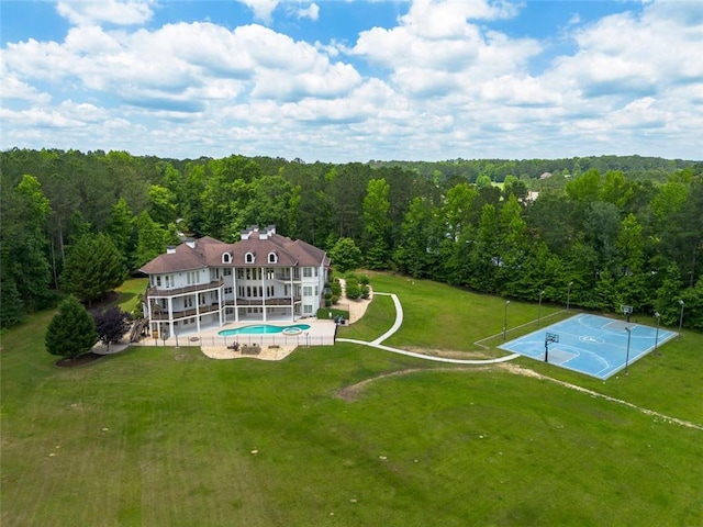 bird's eye view featuring a wooded view