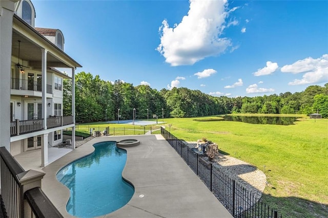 view of pool with a patio, a yard, fence, and a fenced in pool