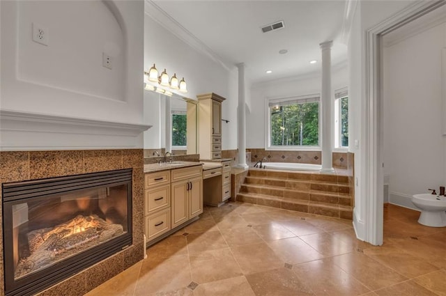 full bathroom with a garden tub, vanity, visible vents, ornamental molding, and a bidet