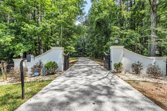 view of gate with fence