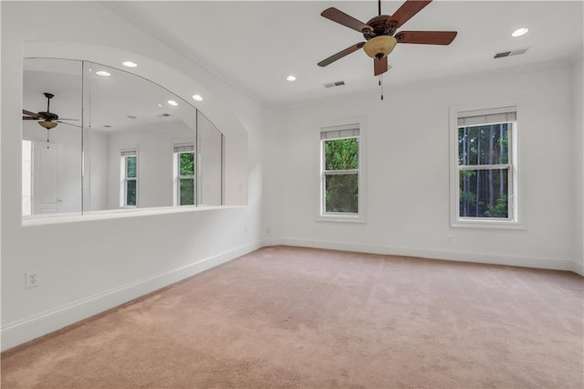 empty room with carpet, visible vents, baseboards, and recessed lighting