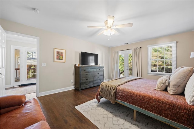 bedroom with dark wood-type flooring, ceiling fan, and access to outside