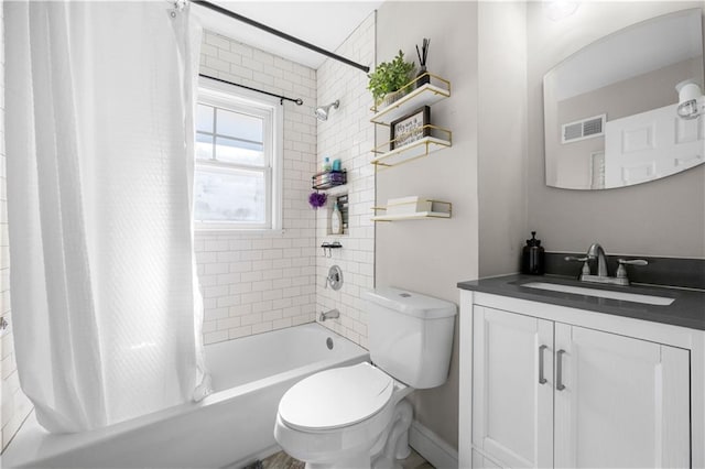 full bathroom featuring vanity, shower / bath combo, and toilet