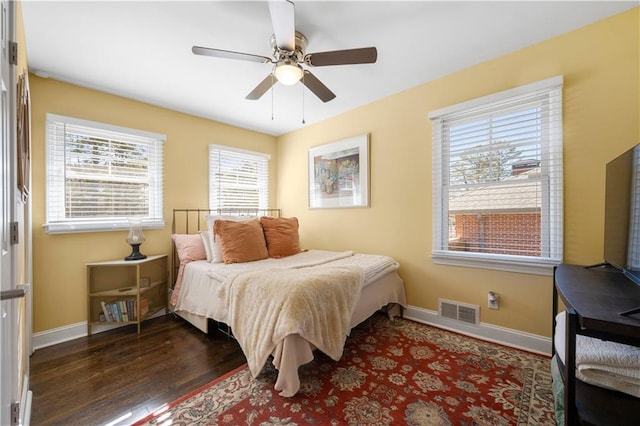 bedroom featuring dark hardwood / wood-style flooring and ceiling fan