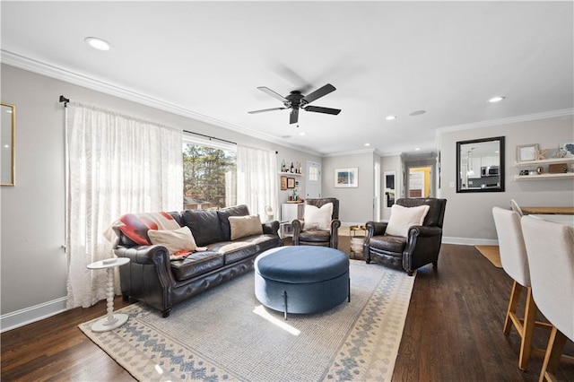 living room featuring dark wood-type flooring, ornamental molding, and ceiling fan