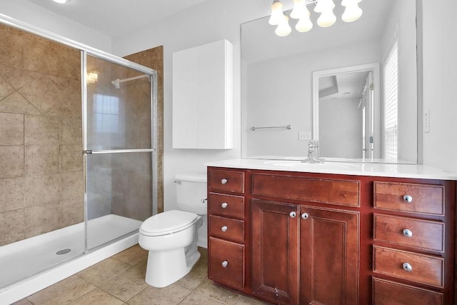 full bath with toilet, a stall shower, an inviting chandelier, tile patterned flooring, and vanity