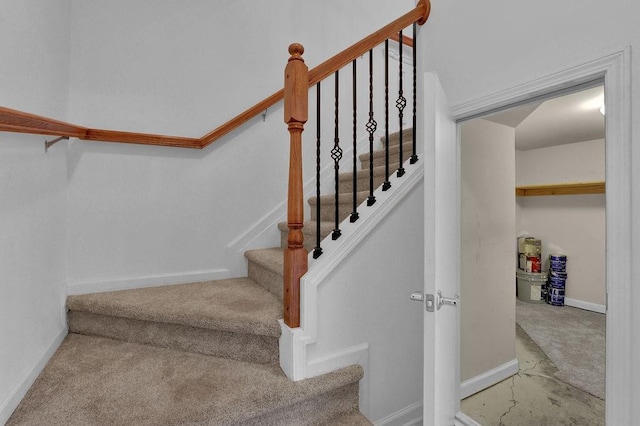 stairway with carpet and baseboards