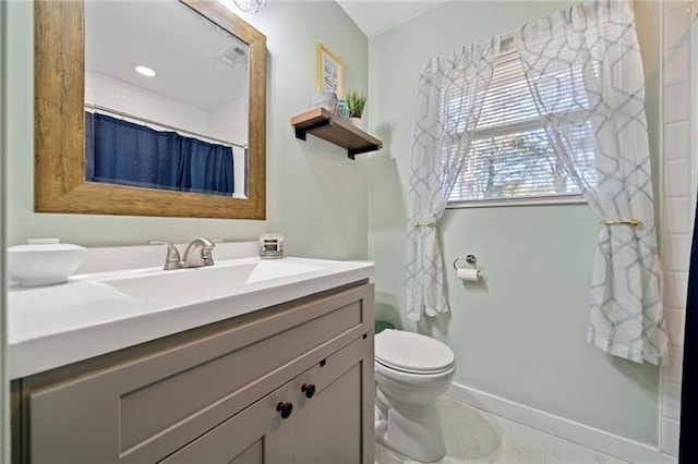 bathroom with toilet, vanity, tile patterned flooring, and a shower with shower curtain