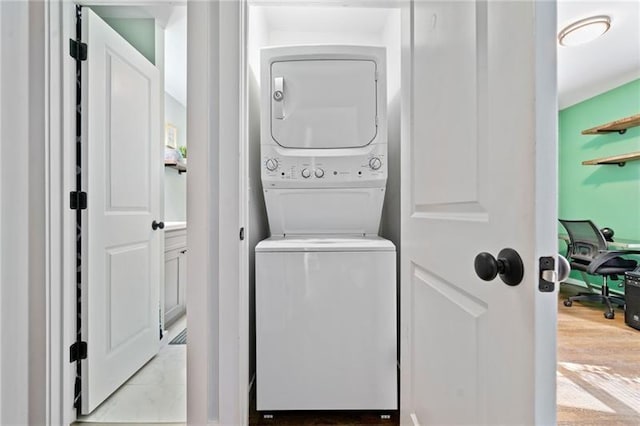 clothes washing area with stacked washer / drying machine