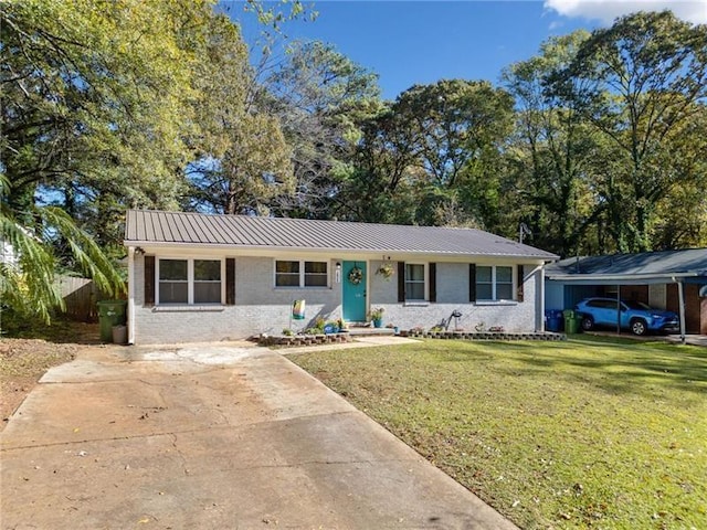 ranch-style house featuring a front lawn and a carport