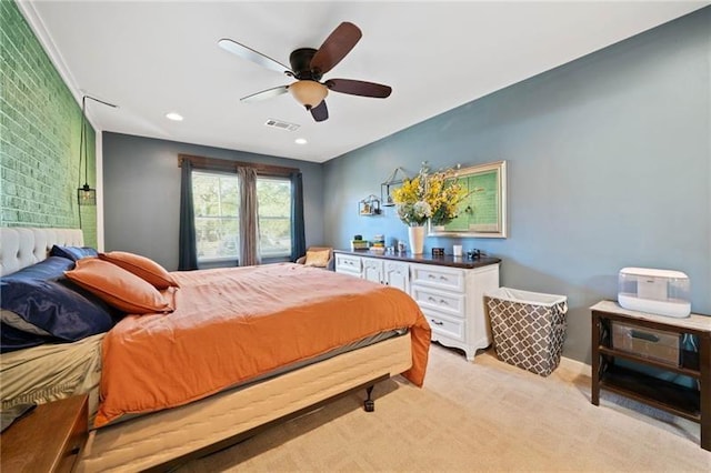 bedroom with ceiling fan and light colored carpet