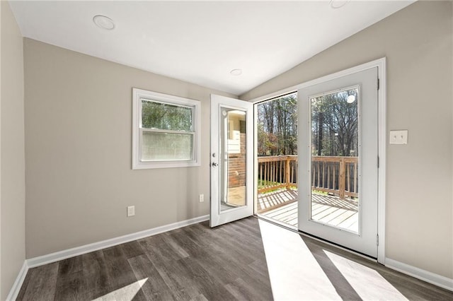 entryway with dark wood-style floors and baseboards