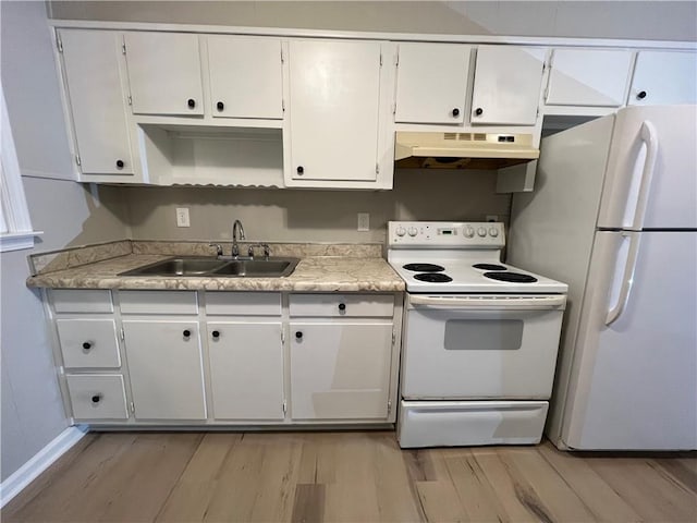 kitchen with under cabinet range hood, white appliances, a sink, light wood-style floors, and light countertops