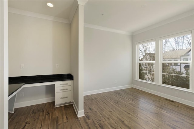 unfurnished office featuring visible vents, ornamental molding, baseboards, dark wood-type flooring, and recessed lighting