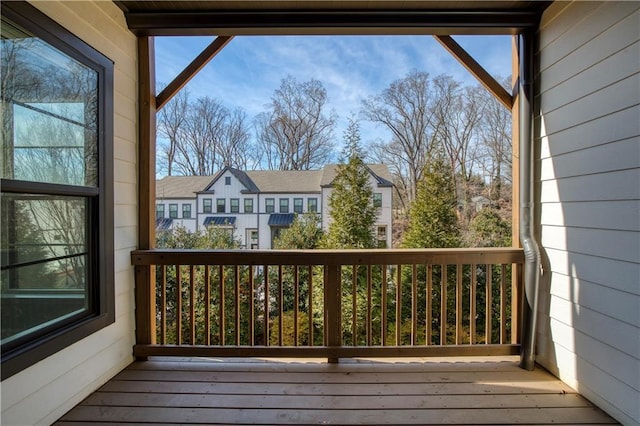 wooden terrace with a residential view