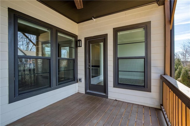 wooden terrace with a porch