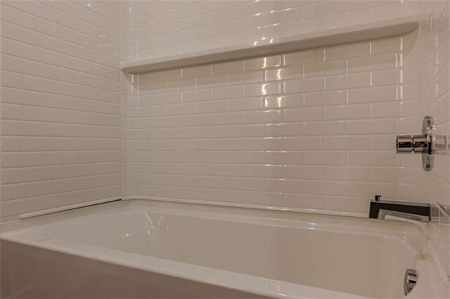 bathroom with shower / tub combination