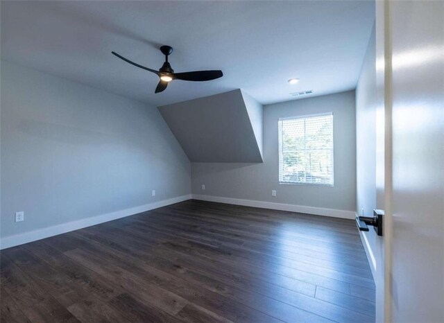 additional living space with ceiling fan and dark hardwood / wood-style flooring