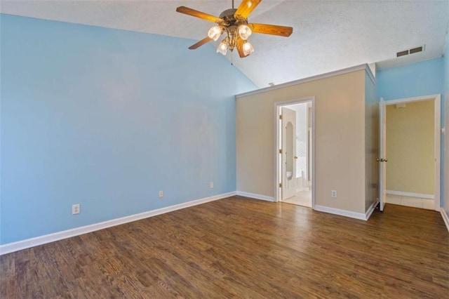 unfurnished room featuring a textured ceiling, dark hardwood / wood-style floors, ceiling fan, and lofted ceiling