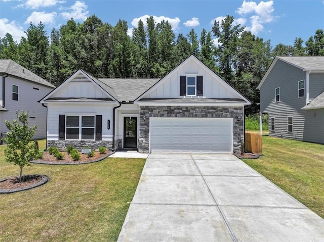 view of front of property featuring a garage and a front lawn