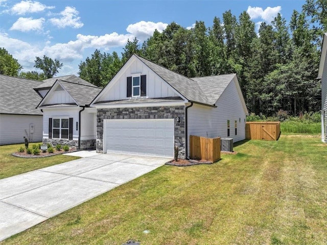 view of front of property featuring a garage and a front yard