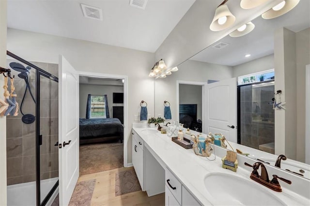 bathroom featuring wood-type flooring, a healthy amount of sunlight, and walk in shower