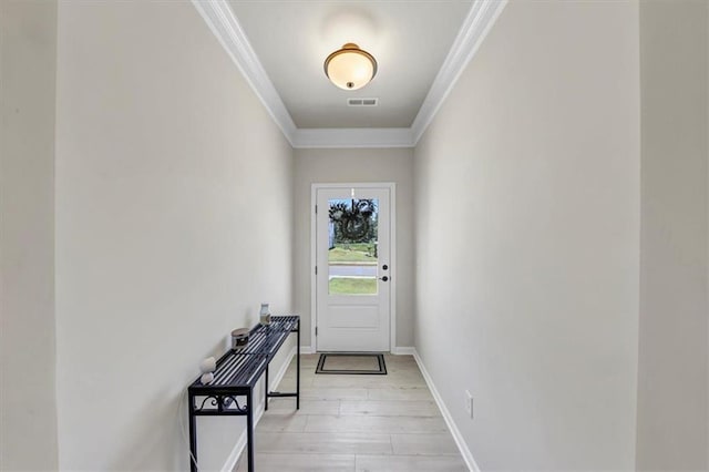 entryway featuring light hardwood / wood-style flooring and ornamental molding