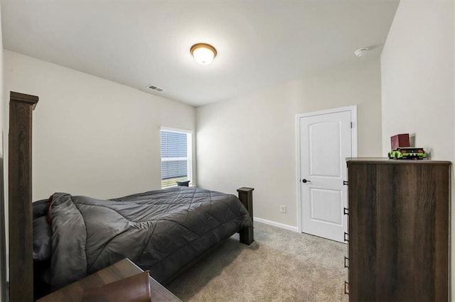 bedroom featuring light carpet