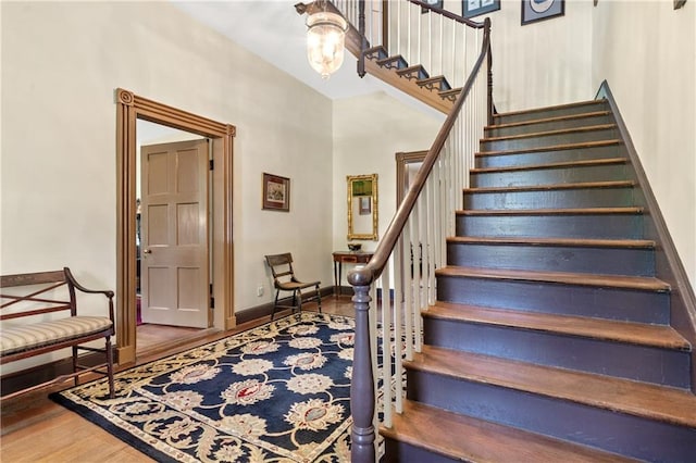 stairs featuring wood-type flooring