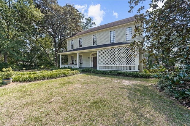 view of front of home featuring a porch and a front yard