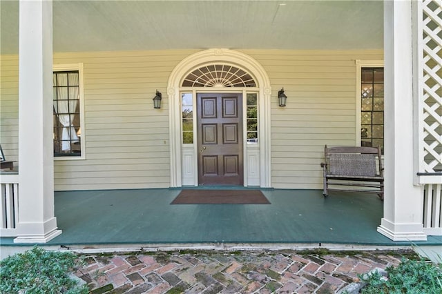 property entrance with covered porch