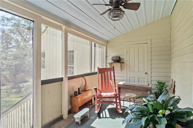 sunroom / solarium featuring ceiling fan and vaulted ceiling