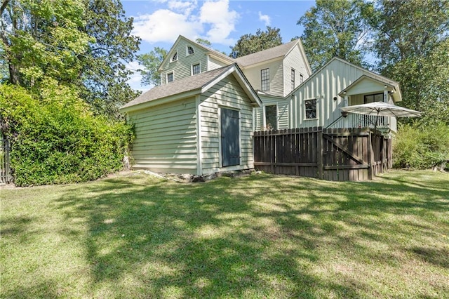 rear view of house with a yard