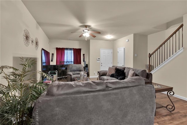 living room featuring hardwood / wood-style flooring and ceiling fan