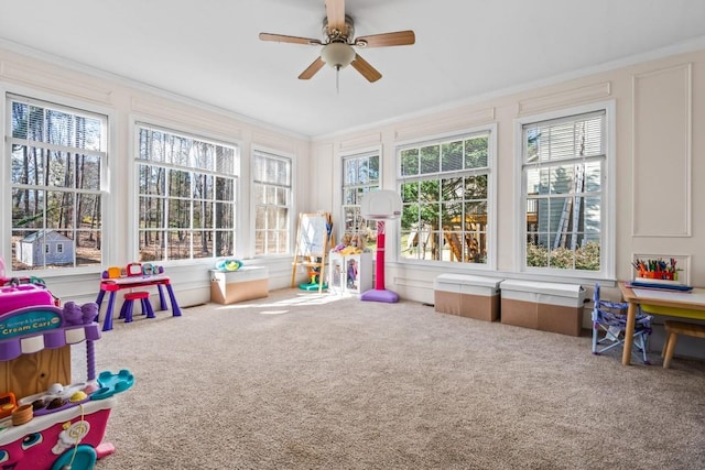 sunroom / solarium featuring ceiling fan