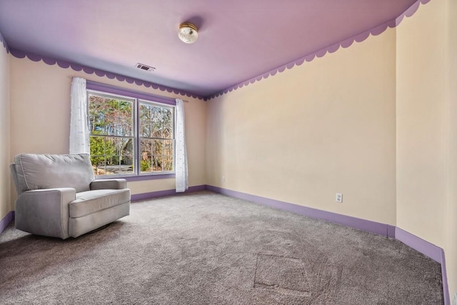 unfurnished room featuring carpet, visible vents, and baseboards