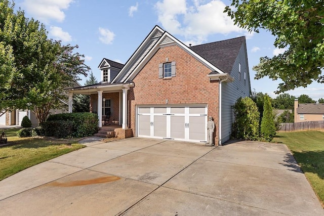 view of front of property featuring a garage and a front yard