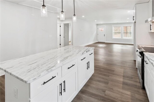 kitchen featuring electric range, dark wood-style flooring, white cabinetry, light stone countertops, and decorative light fixtures