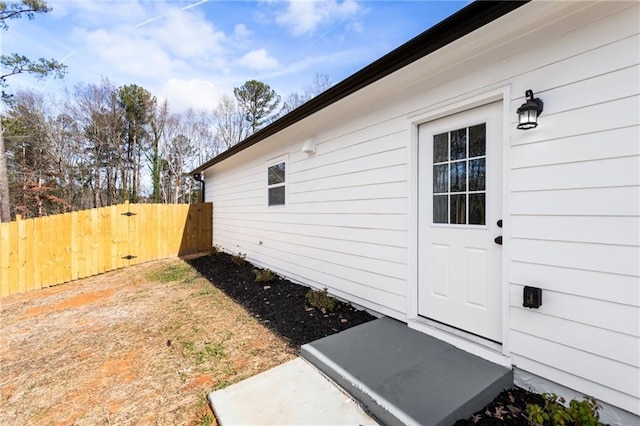 view of property exterior featuring fence